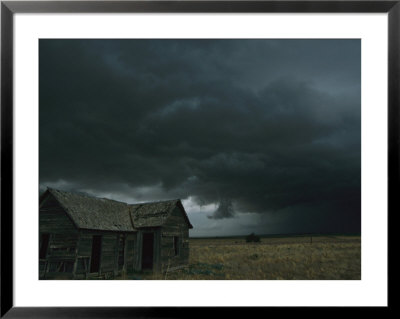Heavy Dark Clouds Foretell A Possible Tornado Near An Old Homestead by Peter Carsten Pricing Limited Edition Print image