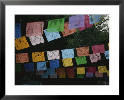 Traditional Mexican Banners Brighten The Street Around The Market by Stephen St. John Pricing Limited Edition Print image