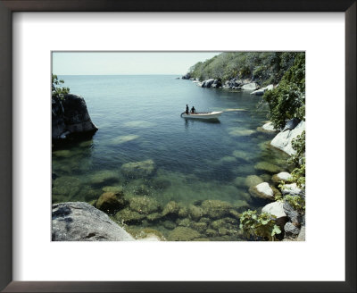 A Small Motorboat In A Lake Malawi Cove by Bill Curtsinger Pricing Limited Edition Print image