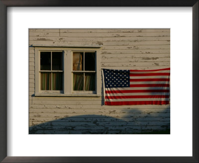 Evening Light On An American Flag On The Side Of An Old Barn by Stephen St. John Pricing Limited Edition Print image