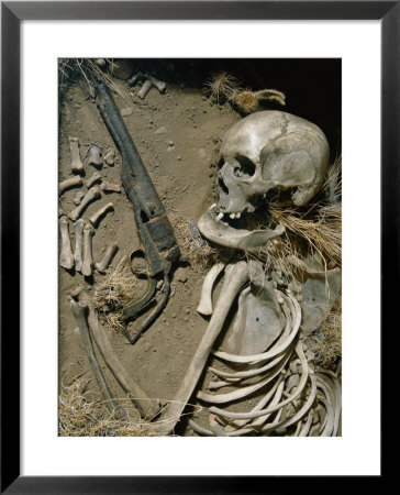 The Sun-Bleached Bones Of Gunslinger Lie Next To His Revolver In Ghost Town In Northwest Wyoming by Paul Chesley Pricing Limited Edition Print image