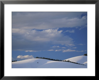 Big Clouds Fill The Sky Over A Hilly Winter Landscape by Michael Melford Pricing Limited Edition Print image
