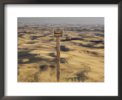A Sign Looks Out Over Rolling, Dune-Like Wheatfields Extending To The Horizon by Robert Madden Pricing Limited Edition Print image