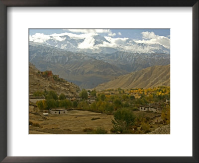 Village With A Buddhist Monastery In Mustang, Himalayas Behind by Stephen Sharnoff Pricing Limited Edition Print image