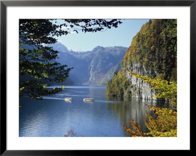 Two Boats Take A Scenic Trip Through A Mountain Valley Of Fall Colors by Norbert Rosing Pricing Limited Edition Print image
