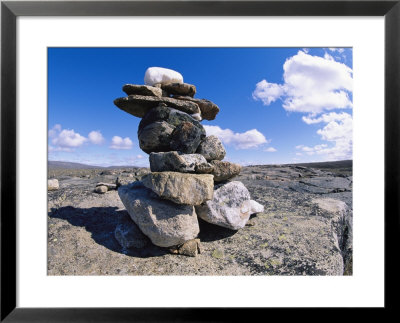 The Stacked Stones Of A Cairn Marker In The Arizona Landscape by Paul Nicklen Pricing Limited Edition Print image