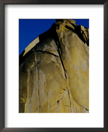 A Rock Climber Climbs A Rock Face Without The Aid Of Hooks Or Ropes In Needles, California by Barry Tessman Pricing Limited Edition Print image