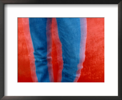 Vibrant Blue Jeans Against A Red Background by Raymond Gehman Pricing Limited Edition Print image