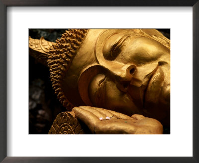 Sleeping Buddha Head With Frangipani Petals In Open Palm, Luang Prabang, Laos by Anthony Plummer Pricing Limited Edition Print image