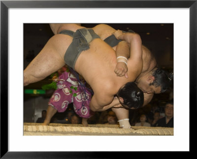Sumo Wrestlers Competing, Grand Taikai Sumo Wrestling Tournament, Kokugikan Hall Stadium, Tokyo by Christian Kober Pricing Limited Edition Print image