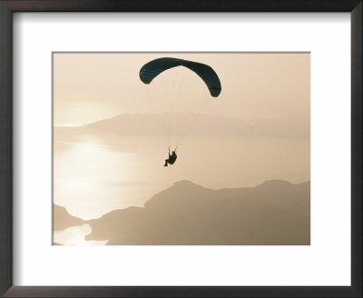Man Paragliding Over The Mediterranean Coast, Fethiye, Turkey by Marco Simoni Pricing Limited Edition Print image