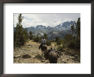 A Horse Packer In A High Mountain Meadow by Gordon Wiltsie Pricing Limited Edition Print image