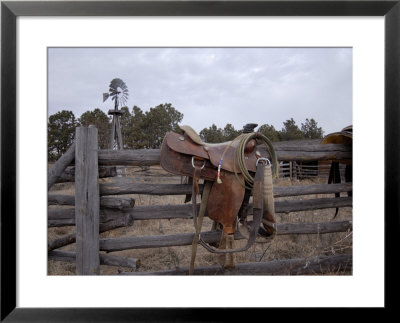 A Saddle Is Left Behind By Some Ranchers In The Nebraska Sandhills by Joel Sartore Pricing Limited Edition Print image