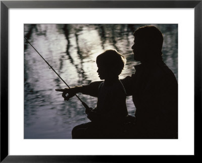 Silhouette Of Father And Five-Year-Old Son Fishing by Kevin Beebe Pricing Limited Edition Print image