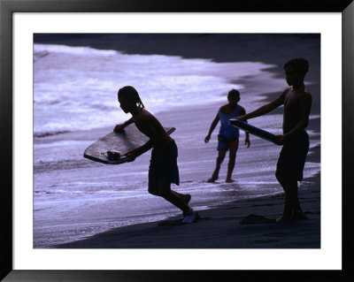 Young Surfers On Black-Sand Beach, French Polynesia by Peter Hendrie Pricing Limited Edition Print image
