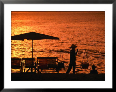 Local Carrying Baskets Along Nha Trang Beach At Sunrise, Nha Trang, Khanh Hoa, Vietnam by John Banagan Pricing Limited Edition Print image