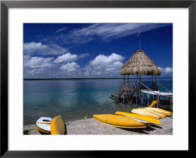 Kayaks For Rent On The Shores Of Lake Peten Itza Near Tikal, El Peten, Guatemala by Greg Johnston Pricing Limited Edition Print image