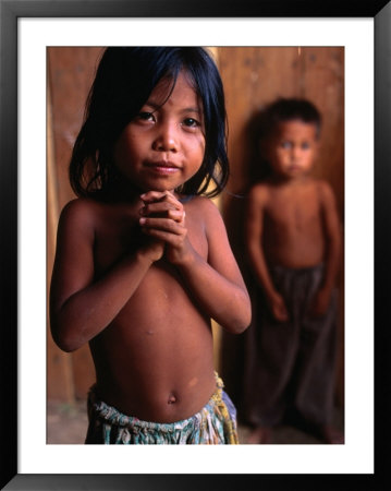 Portrait Of Young Girl With Little Boy Behind, Bavel, Cambodia by Jerry Galea Pricing Limited Edition Print image