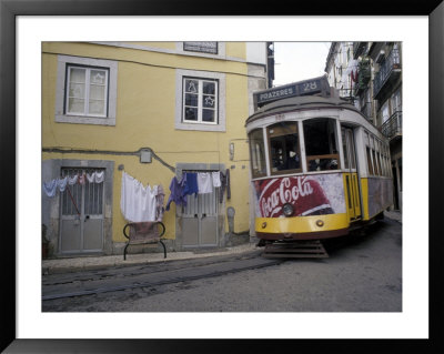 Cable Car In Narrow Streets, Lisbon, Portugal by Michele Molinari Pricing Limited Edition Print image