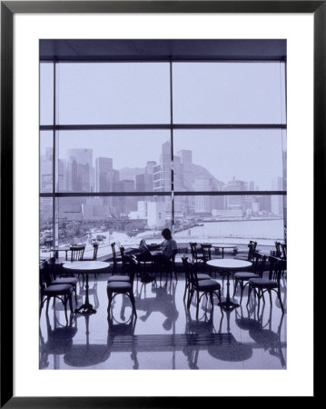 Man Reading Paper, Hong Kong, China by Walter Bibikow Pricing Limited Edition Print image