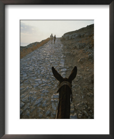 A Couple And A Donkey Walk Up The Cobblestone Road To The Acropolis by Tino Soriano Pricing Limited Edition Print image