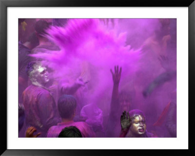 People Painted With Bright Colors Dance During The Festival Of Holi On March 7, 2004 by Anupam Nath Pricing Limited Edition Print image