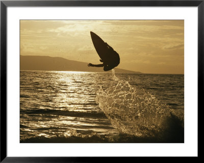 An Airborne Skimboarder Is Silhouetted At Twilight by Skip Brown Pricing Limited Edition Print image