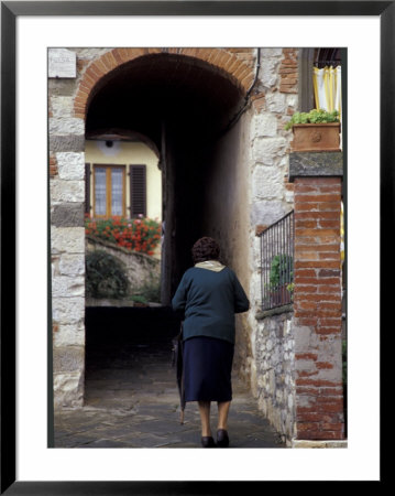 Woman Walking Into Covered Alley, Radda In Chianti, Tuscany, Italy by John & Lisa Merrill Pricing Limited Edition Print image