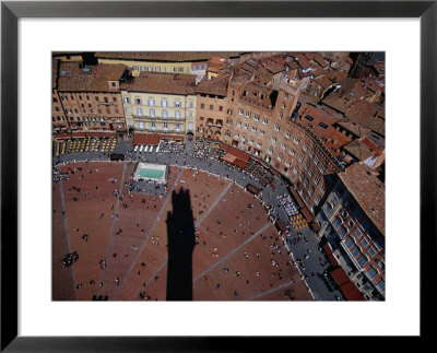 Bustle Of Il Campo From Top Of Torre Del Mangia, With Tower Shadow Across Square, Siena, Italy by Glenn Beanland Pricing Limited Edition Print image