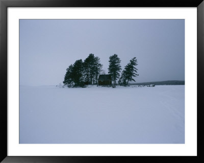 Winter Freezes Moosehead Lake Around An Island Cottage by Heather Perry Pricing Limited Edition Print image