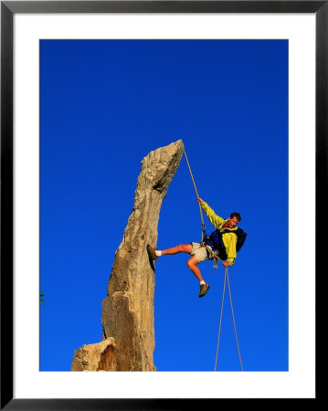 Man Rock Climbing, Joshua Tree National Park, Ca by Greg Epperson Pricing Limited Edition Print image