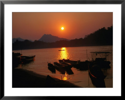 The Sun Setting Over Luang Prabang - Northern Laos, Luang Prabang, Laos by Juliet Coombe Pricing Limited Edition Print image