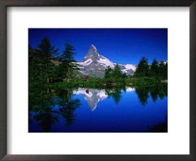 The Matterhorn And Hiker Reflected In Waters Of Grindjisee, Valais, Switzerland by Gareth Mccormack Pricing Limited Edition Print image