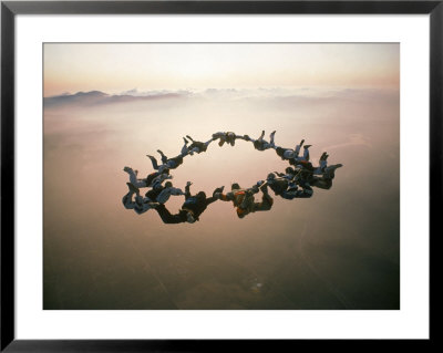 Sky Divers Doing A Maneuver In The Air by Ips Agency Pricing Limited Edition Print image