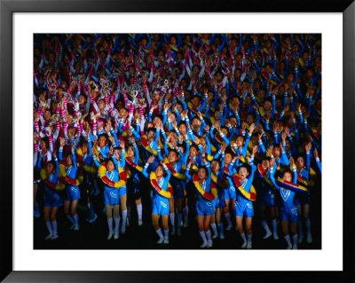 Boys And Girls Dance In Formation During Arirang Mass Games, P'yongyang, North Korea by Tony Wheeler Pricing Limited Edition Print image