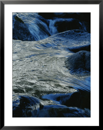 Water Swirls Around Rocks In Yosemite National Park by Marc Moritsch Pricing Limited Edition Print image