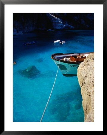 Boat In Water Of Cala De Mariolu, Golfo Di Orosei, Italy by Damien Simonis Pricing Limited Edition Print image