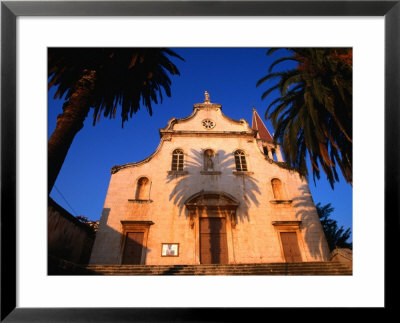 Palm Tree Shadow On Church, Milna, Croatia by Wayne Walton Pricing Limited Edition Print image