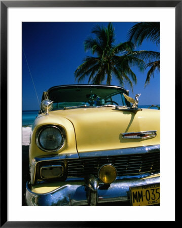 Old Yellow Chevrolet, Parked By The Ocean, Varadero, Matanzas, Cuba by Martin Llado Pricing Limited Edition Print image