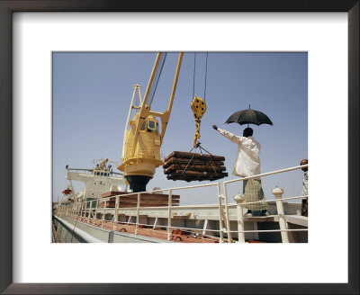 Unloading Freight From A Ship Docked In Khulna by Dick Durrance Pricing Limited Edition Print image
