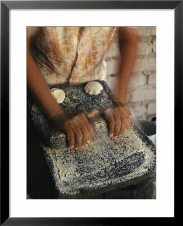 A Cora Woman Grinds Corn For Tortillas by Maria Stenzel Pricing Limited Edition Print image
