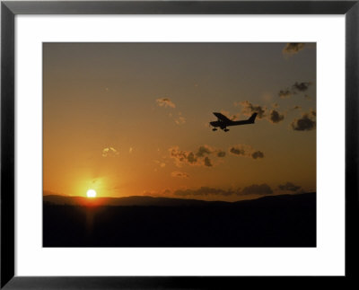 Small Plane In Flight, Sunset by Charles Shoffner Pricing Limited Edition Print image