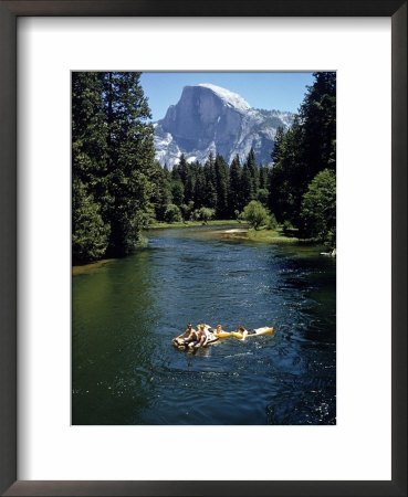 Tourists Float On A Raft In The Merced River At Yosemite National Park by Ralph Crane Pricing Limited Edition Print image