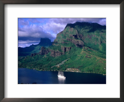 A Sailboat Cruises Past Mountainous Shoreline, Moorea, Society Islands, The, French Polynesia by Peter Hendrie Pricing Limited Edition Print image