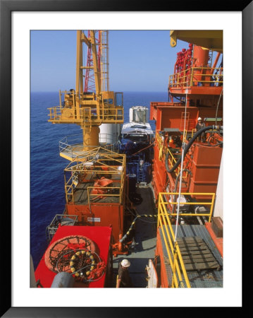 Workers On Offshore Oil Rig In The Gulf Of Mexico by Jim Mcnee Pricing Limited Edition Print image