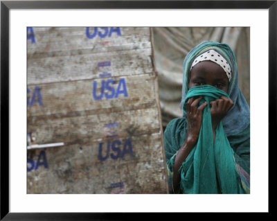 A Somali Child Covers Her Face At Dadaab Refugee Camp In Northern Kenya Monday, August 7 2006 by Karel Prinsloo Pricing Limited Edition Print image