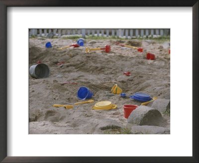 A Childs Colorful Toys Are Scattered Throughout A Sand Box by Roy Gumpel Pricing Limited Edition Print image