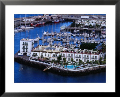 Building And Boats Of Marina, Puerto De Mogan, Canary Islands, Spain by Tony Wheeler Pricing Limited Edition Print image