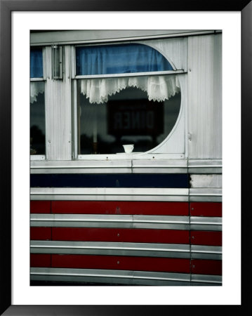 A Sign Is Reflected In The Window Of Local Diner by Stephen St. John Pricing Limited Edition Print image