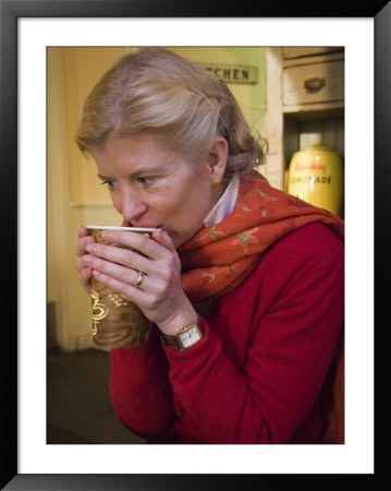 A Woman Enjoys A Cup Of Coffee On A Winter Day, New York, New York by Taylor S. Kennedy Pricing Limited Edition Print image
